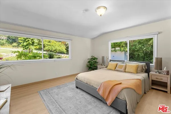 a kitchen with granite countertop a stove and cabinets
