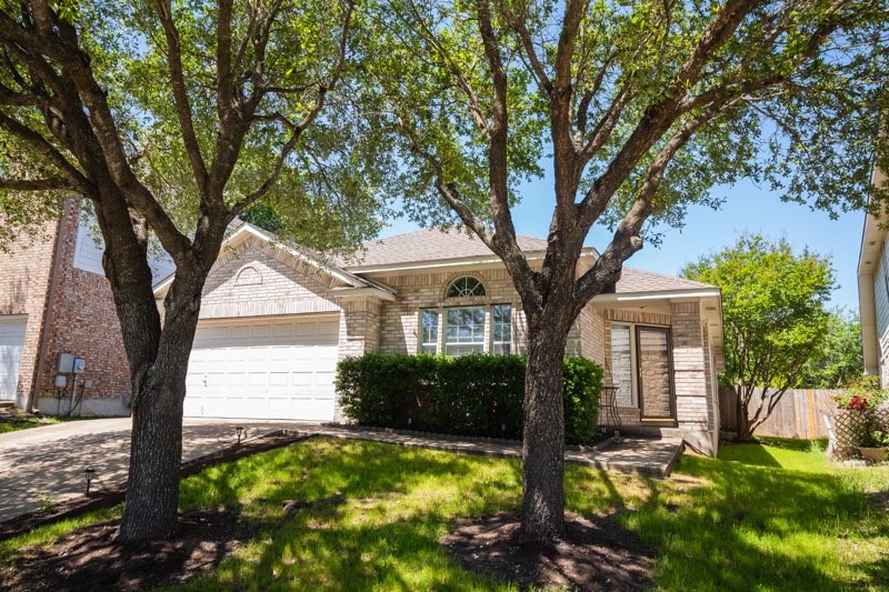 3704 Norman Loop Round Rock, TX 78664 - Photo 1 of 1 a front view of a house with garden
