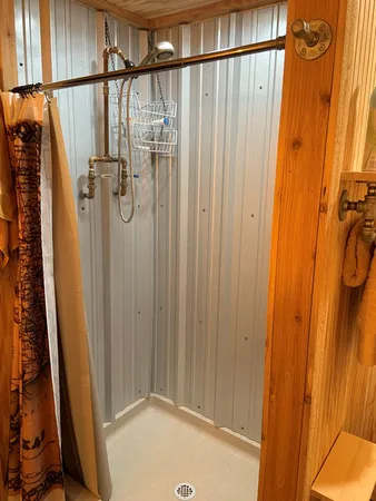 a bathroom with a shower and a tub