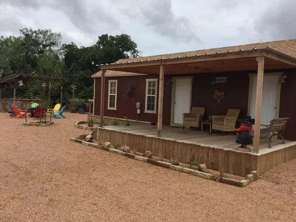a view of a house with sitting area and furniture
