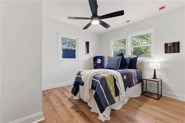 a bedroom with bed and a window