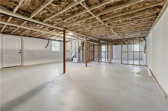 a kitchen with a stove a sink and a microwave