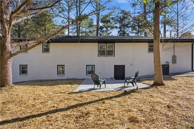 a view of a house with snow on the road
