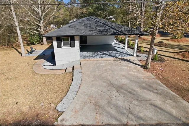 a view of house with a yard