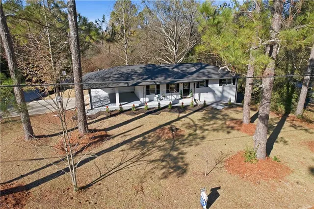 a aerial view of a house with a yard