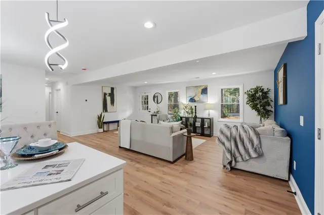 a dining room with furniture and a chandelier