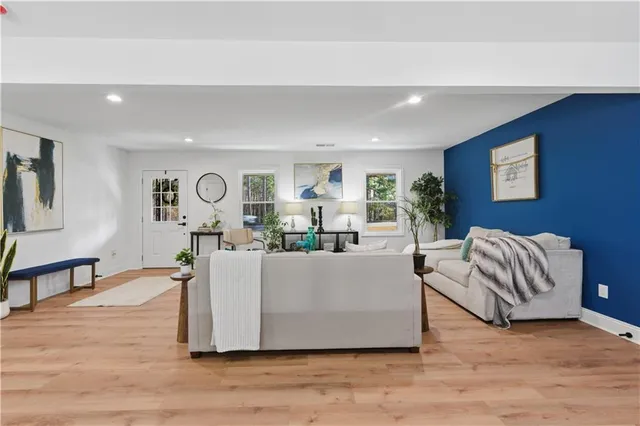 a view of a dining room with furniture window and wooden floor