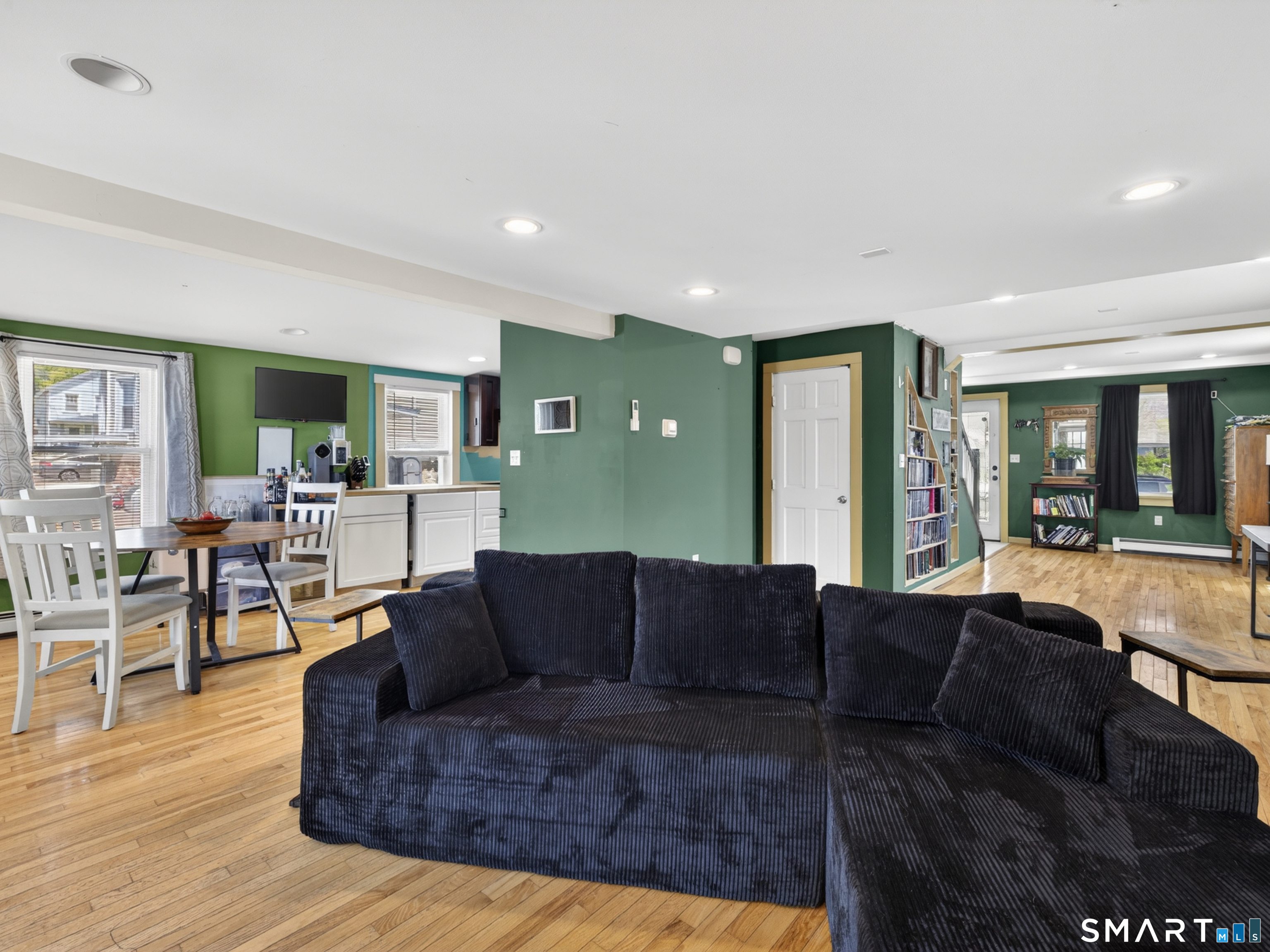 13 Oak Street Groton, CT 06340 - Photo 8 of 38 a living room with furniture and a wooden floor