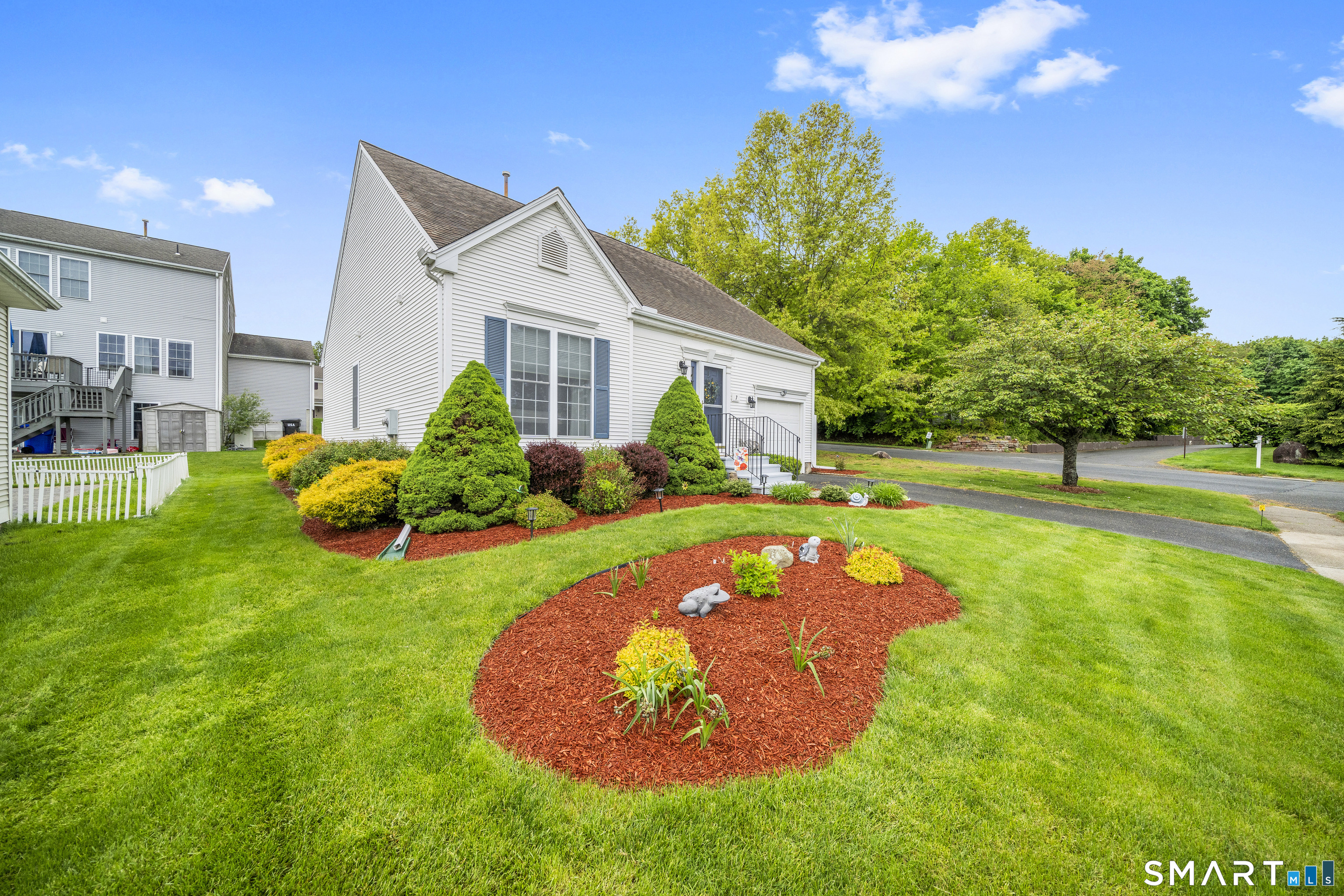 7 Heather Lane, Unit 7 Suffield, CT 06078 - Photo 4 of 34 a view of a house with a backyard