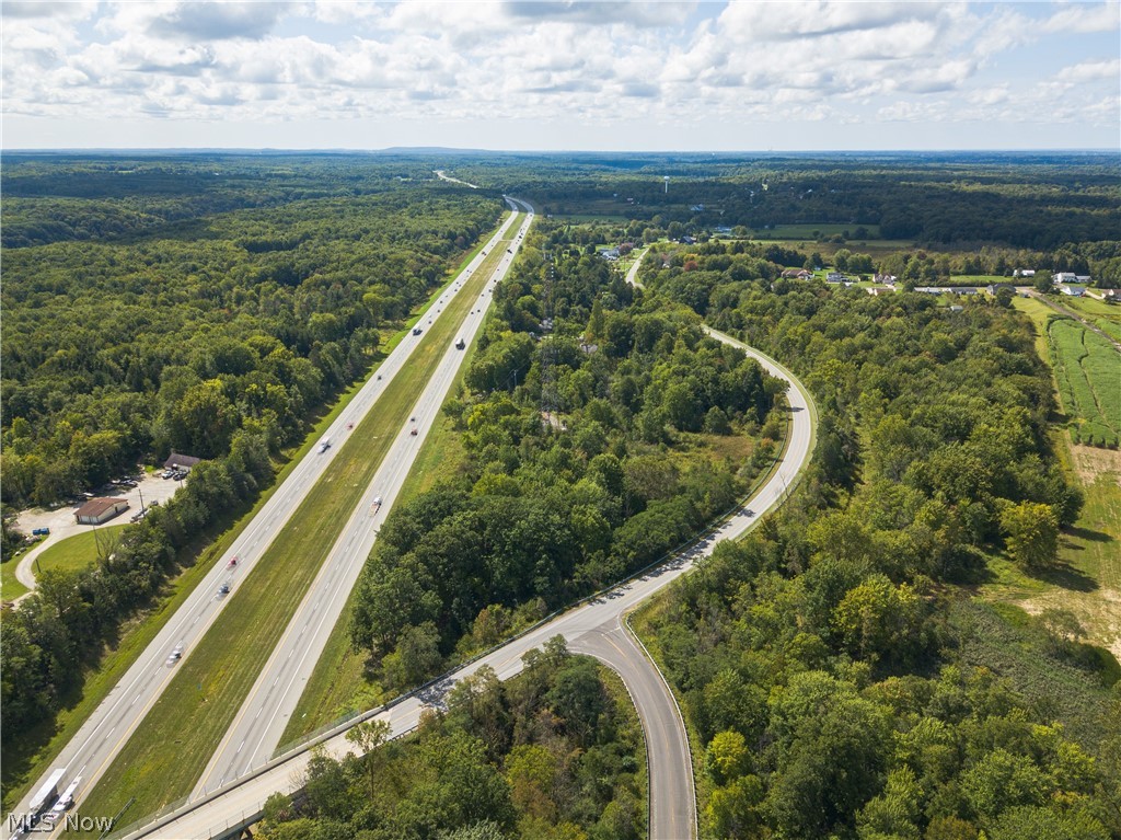 River Road Madison, OH 44057 - Photo 4 of 9 Aerial view showing the parcel between I-90 and River Road with Dayton Road approaching the parcel.
