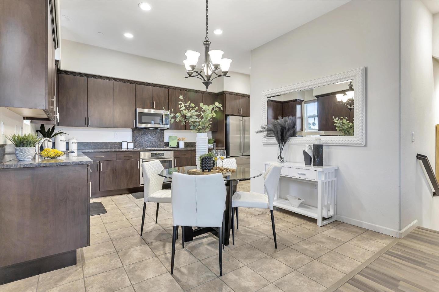 5814 Riley Way Newark, CA 94560 - Photo 12 of 46 a view of kitchen with kitchen island dining table and chairs