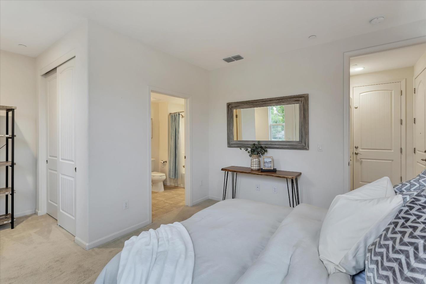 5814 Riley Way Newark, CA 94560 - Photo 23 of 46 a bedroom with a bed and a table in it