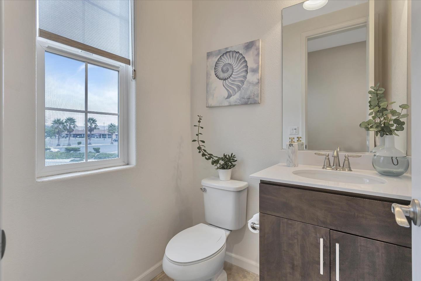 5814 Riley Way Newark, CA 94560 - Photo 26 of 46 a bathroom with a toilet a sink and mirror
