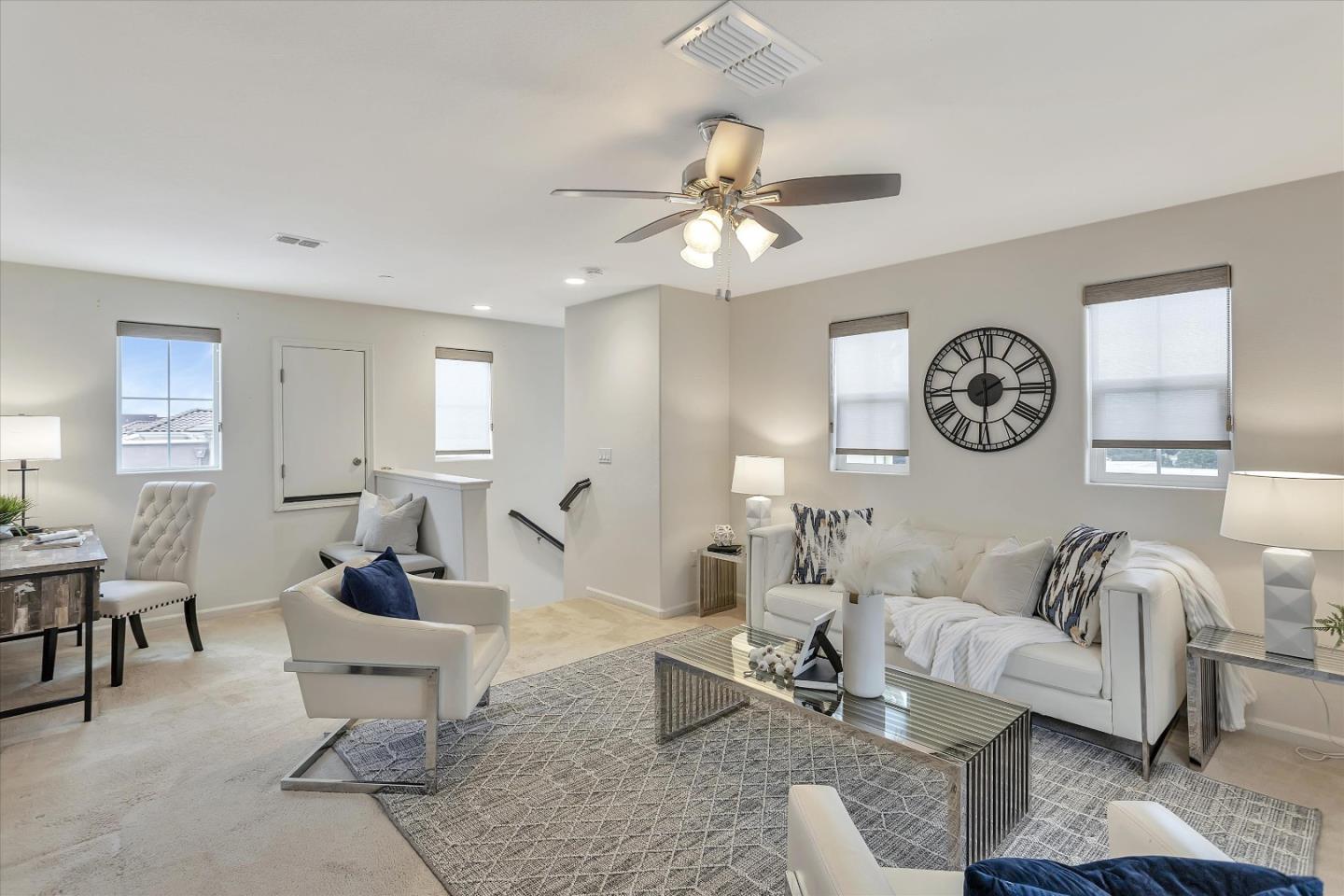 5814 Riley Way Newark, CA 94560 - Photo 7 of 46 a living room with furniture a clock on wall and a window
