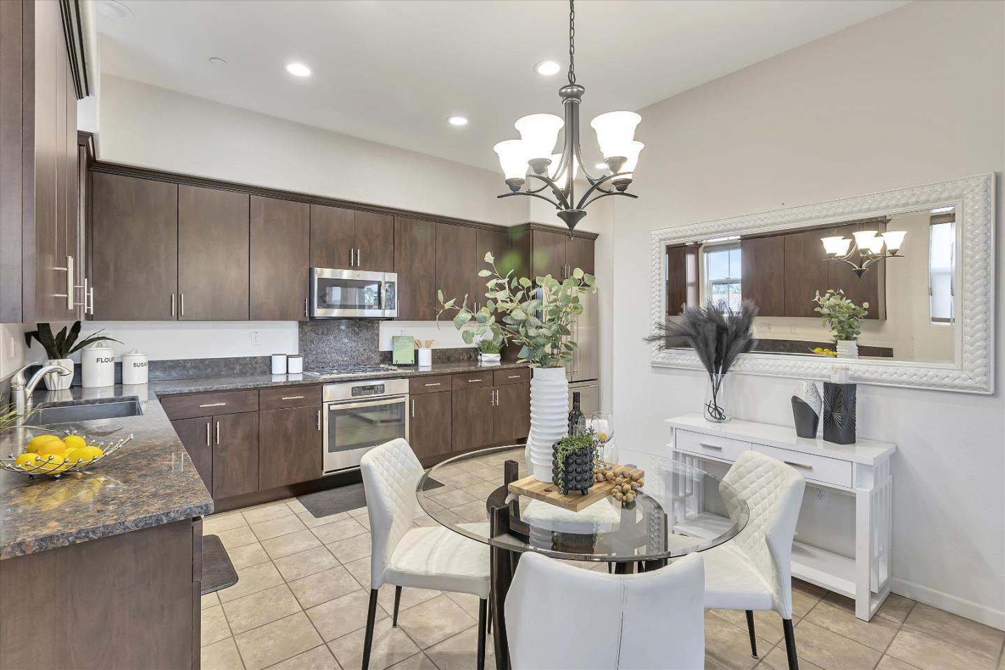 5814 Riley Way Newark, CA 94560 - Photo 9 of 46 a view of a dining room with furniture and a chandelier