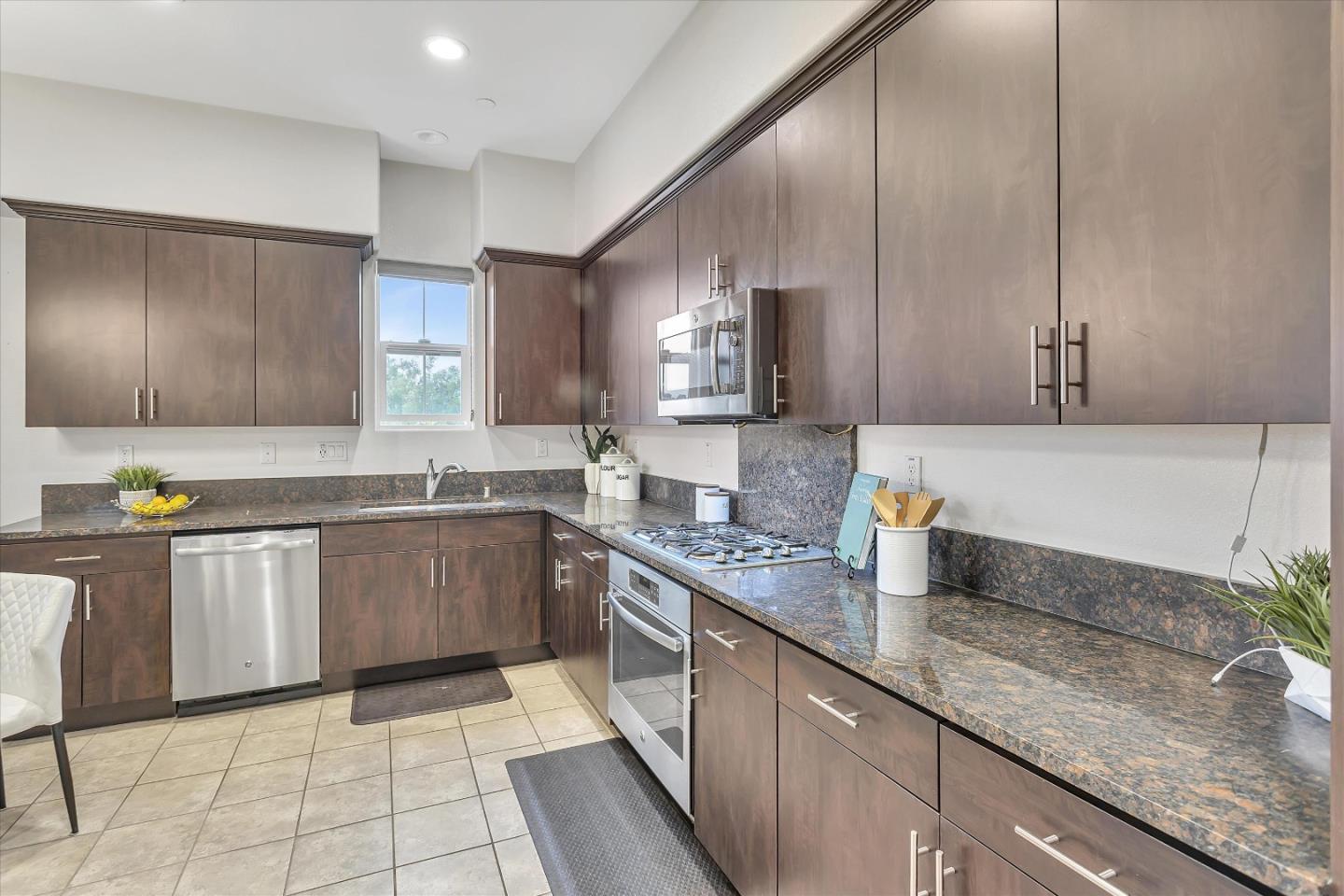 5814 Riley Way Newark, CA 94560 - Photo 10 of 46 a kitchen with a sink stove and cabinets