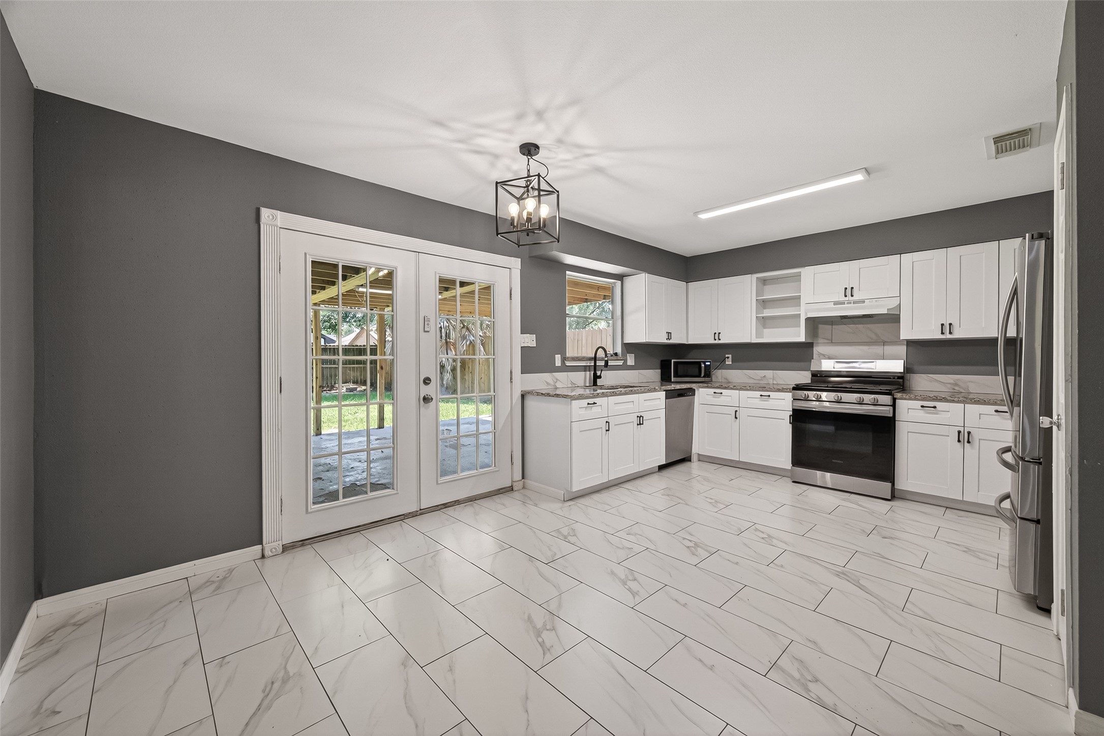 24006 Lone Elm Drive Spring, TX 77373 - Photo 6 of 25 Double doors lead to back patio