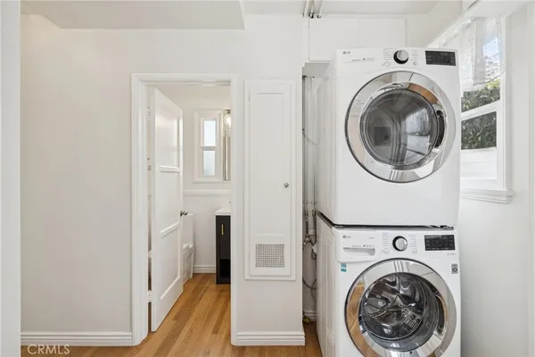 a view of a hallway with washer and dryer