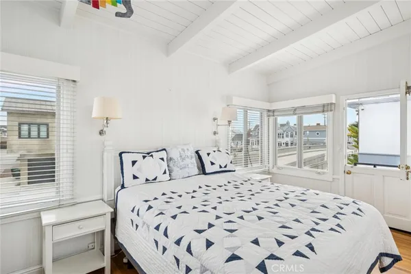 a room with a bed and a large window