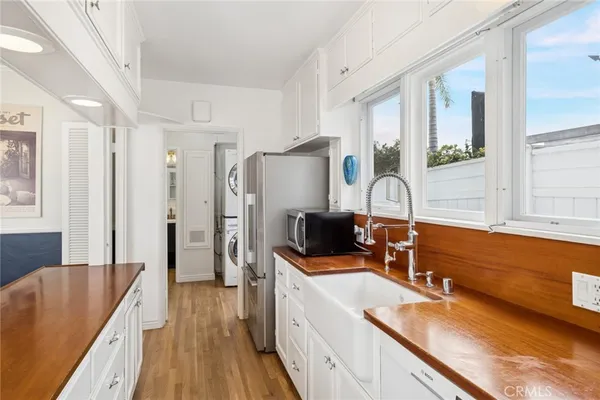 a kitchen with a sink stove and refrigerator