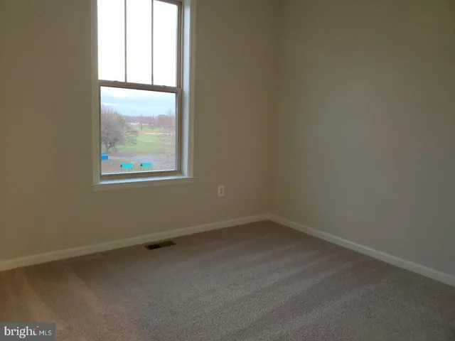 an empty room that has a window