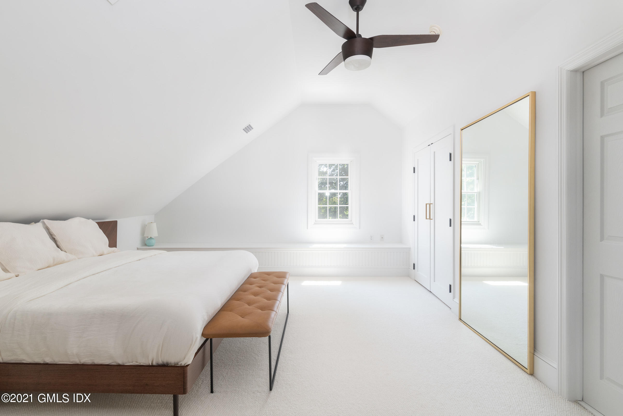 6 Park Avenue Greenwich, CT 06830 - Photo 12 of 24 a view of a bedroom with furniture and windows