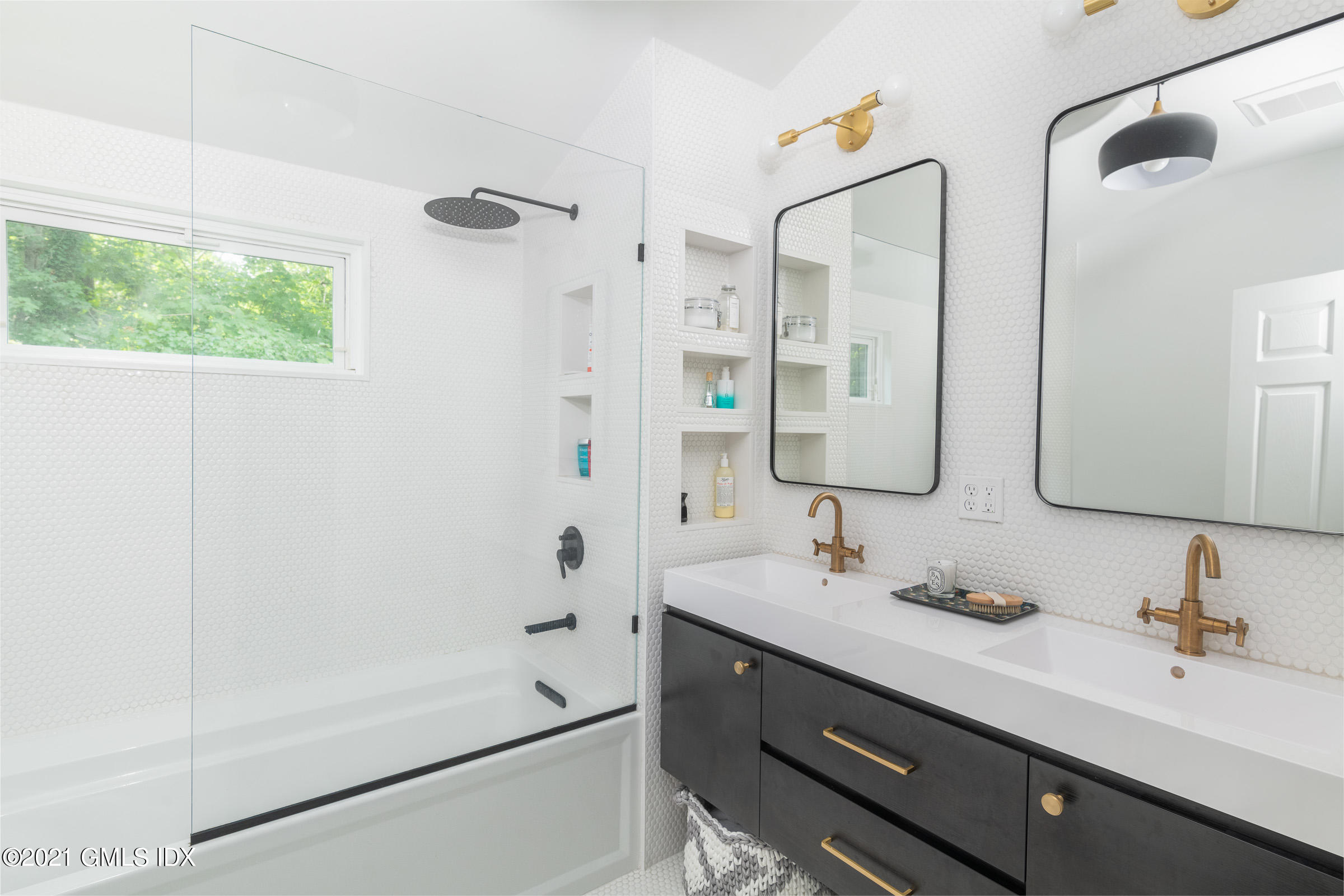 6 Park Avenue Greenwich, CT 06830 - Photo 13 of 24 a bathroom with a double vanity sink mirror and shower