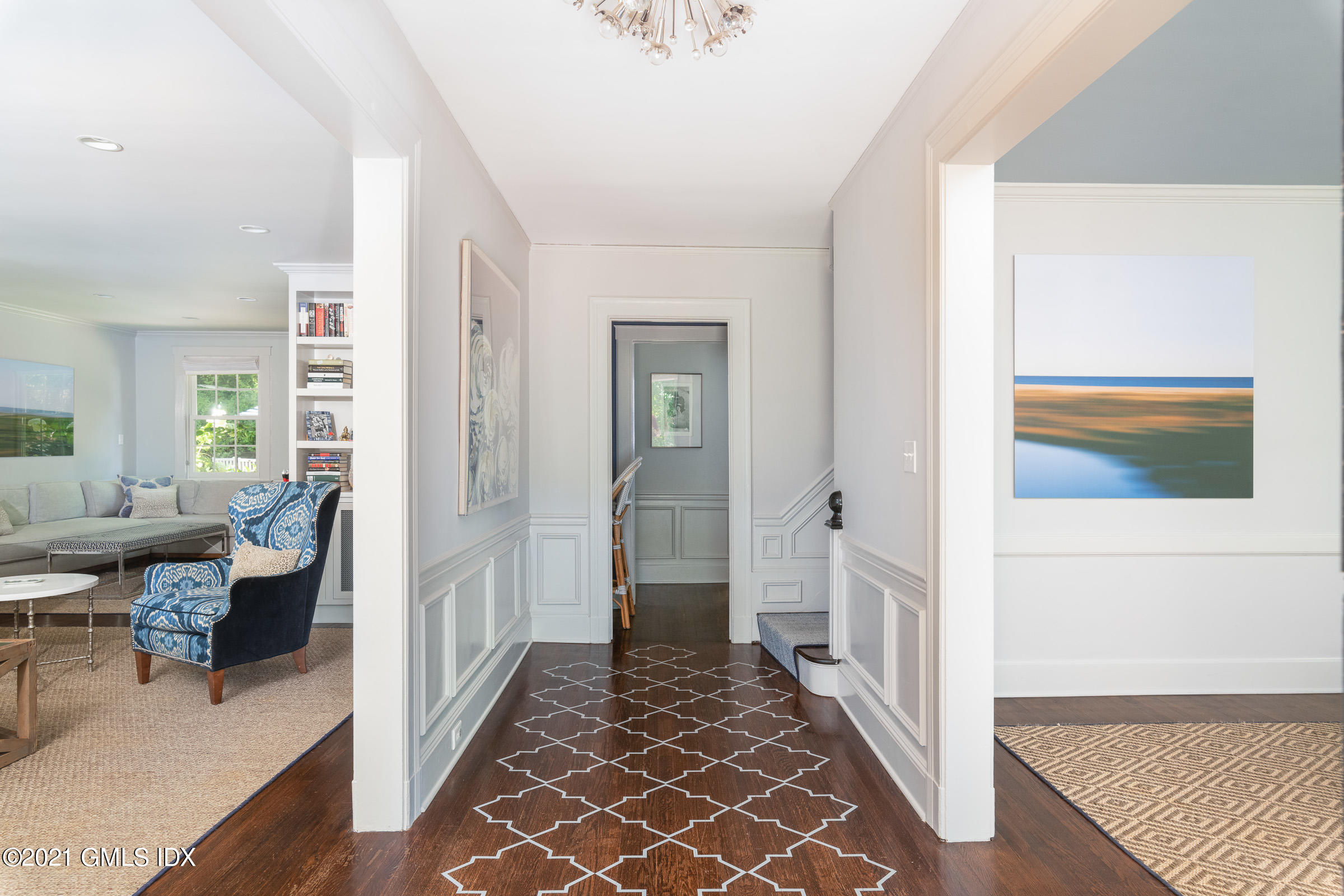 6 Park Avenue Greenwich, CT 06830 - Photo 2 of 24 a view of a hallway with wooden floor and furniture