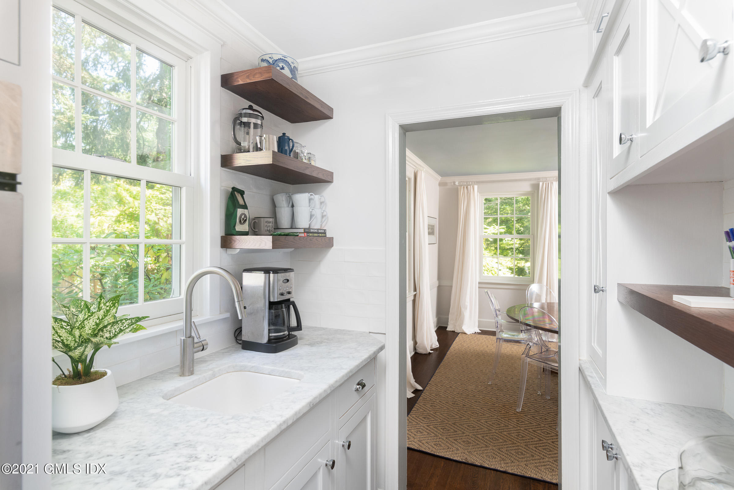 6 Park Avenue Greenwich, CT 06830 - Photo 5 of 24 a kitchen with stainless steel appliances granite countertop a sink a stove and a window