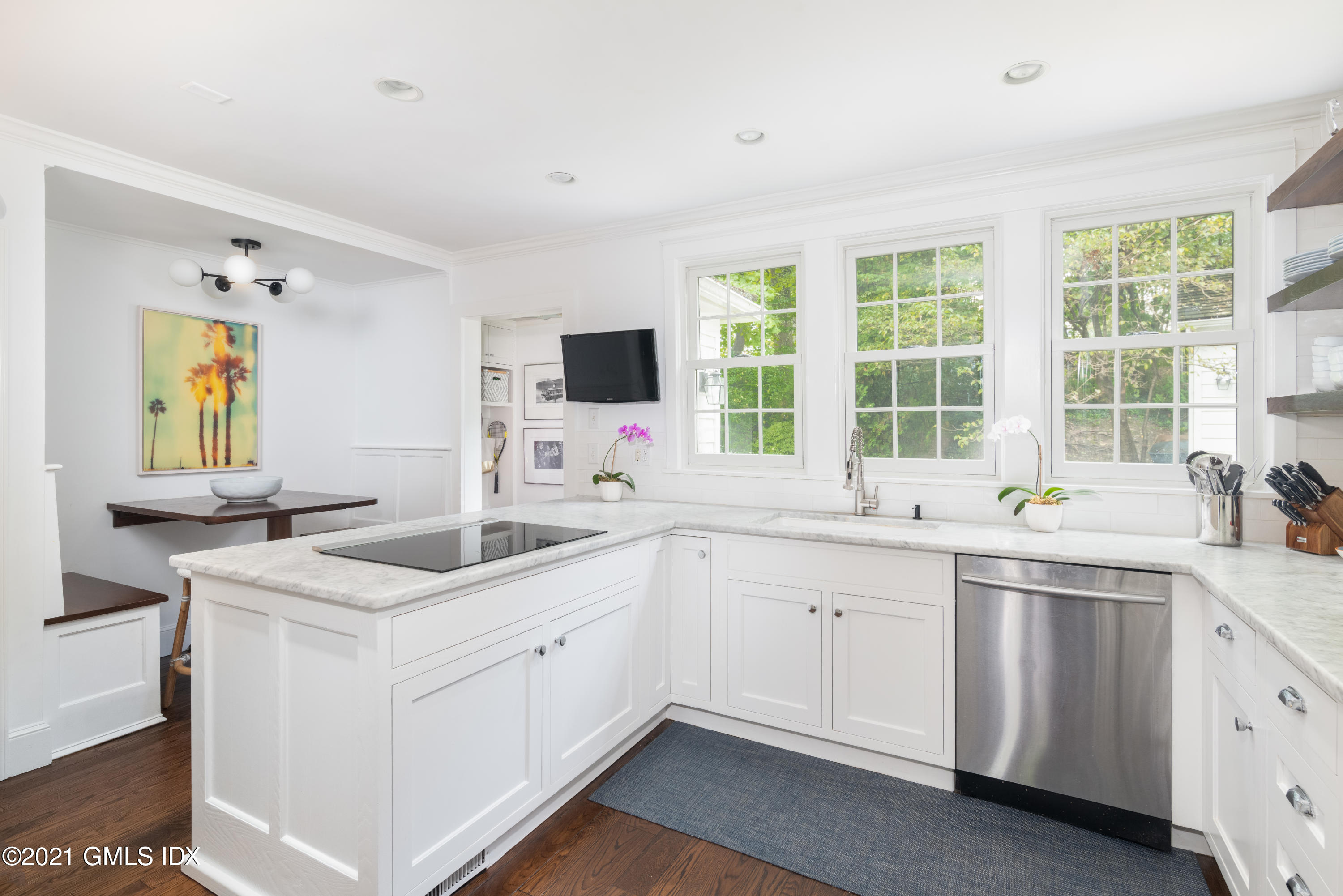 6 Park Avenue Greenwich, CT 06830 - Photo 8 of 24 a kitchen with a sink stove and cabinets