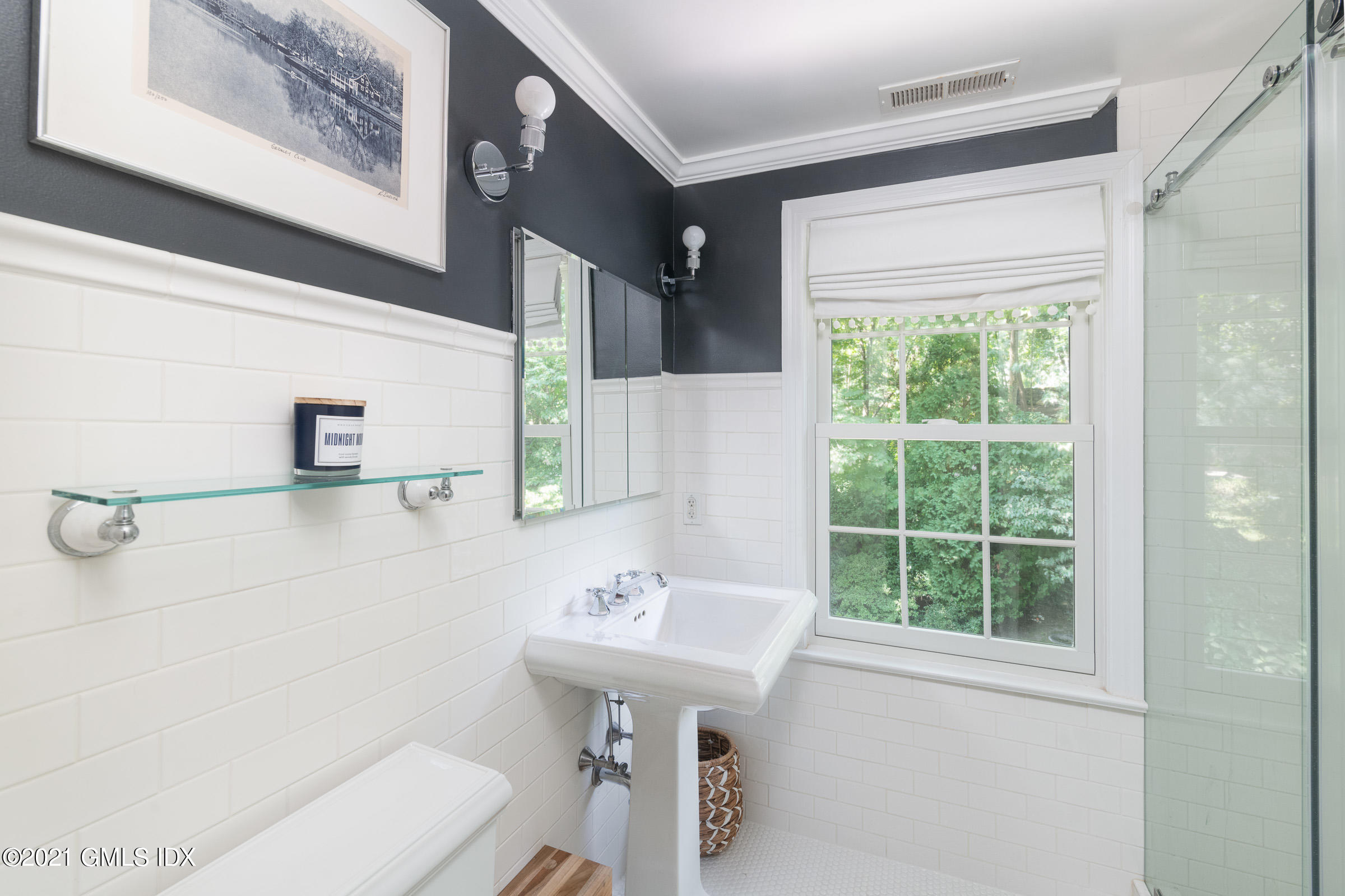 6 Park Avenue Greenwich, CT 06830 - Photo 9 of 24 a bathroom with a sink a toilet and shower