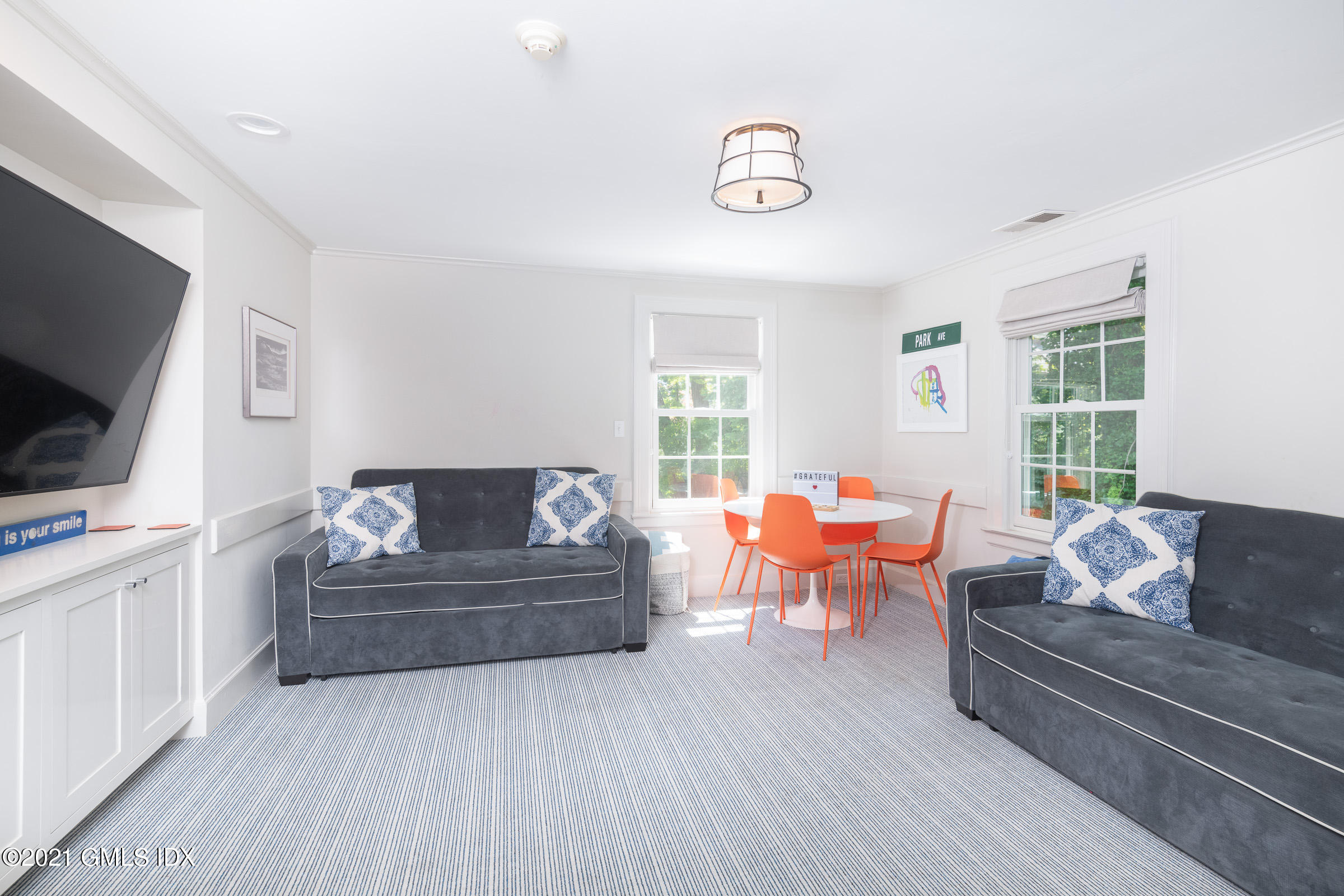 6 Park Avenue Greenwich, CT 06830 - Photo 10 of 24 a living room with furniture and a flat screen tv