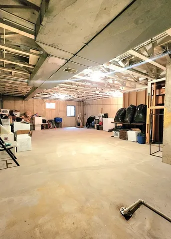 a view of parking garage with cars