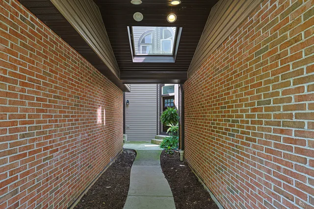 a view of a pathway besides a house