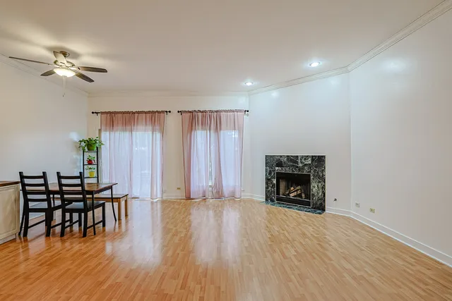 a view of livingroom with furniture fireplace and wooden floor