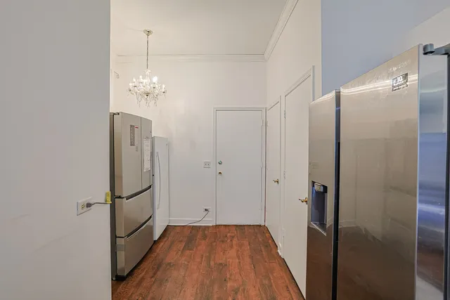 a view of a bathroom with a shower and mirror