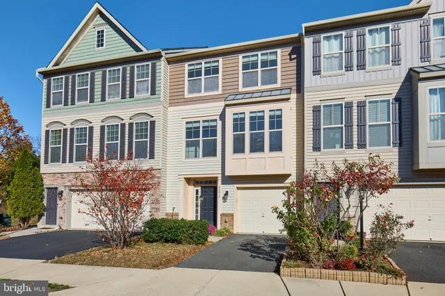 a front view of a house with yard