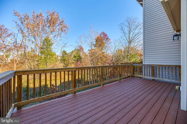 a view of deck with wooden floor and fence