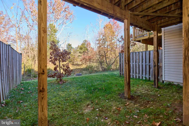 a view of a backyard of the house