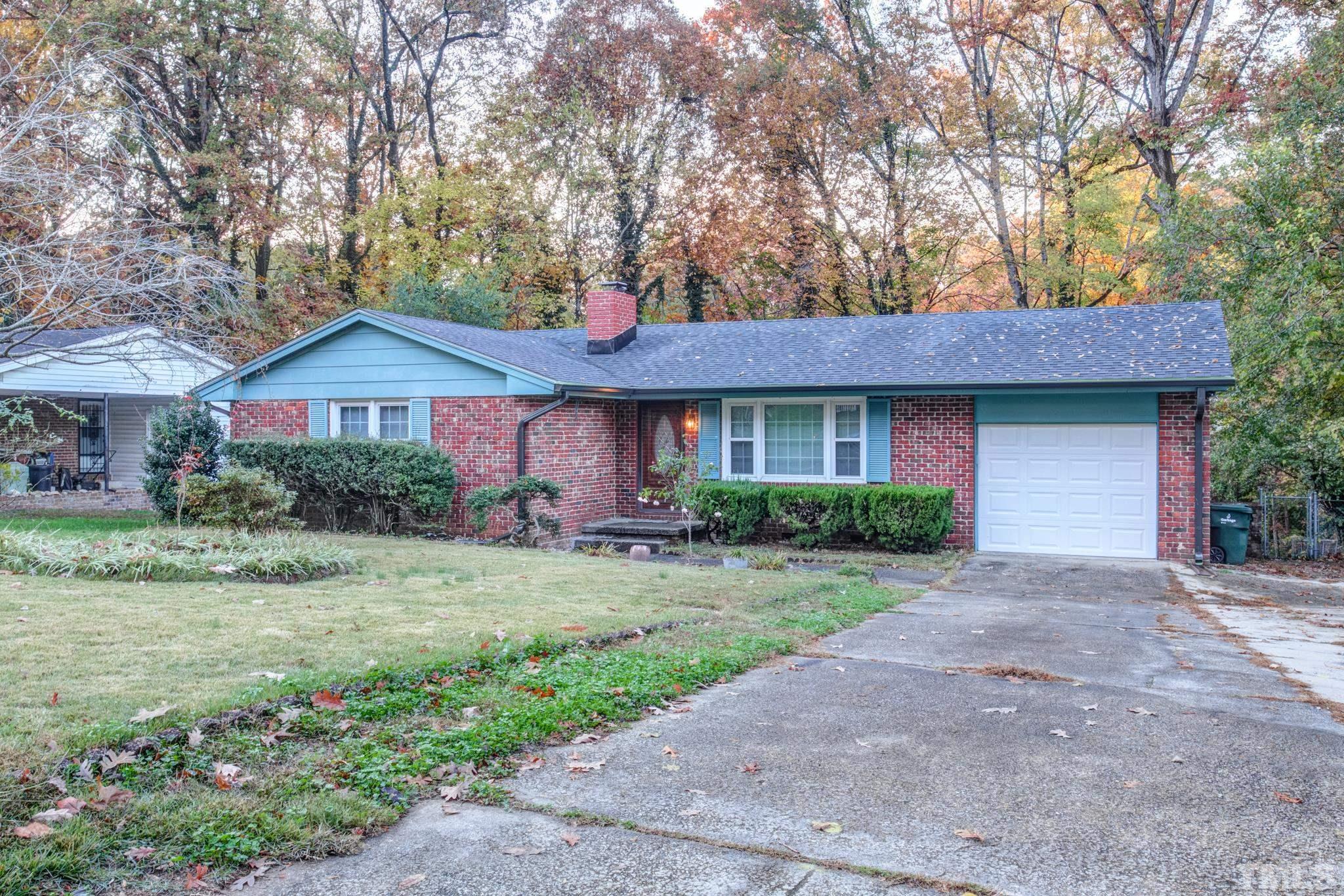 3213 Julian Drive Raleigh, NC 27604 - Photo 1 of 54 a front view of a house with a garden