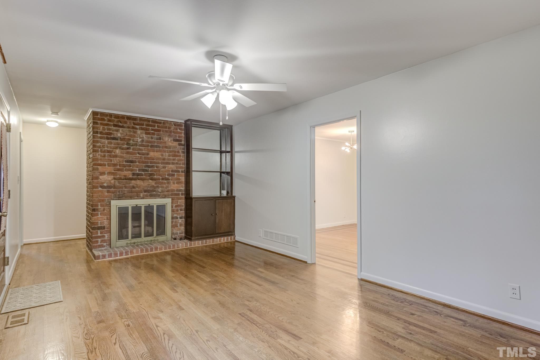 3213 Julian Drive Raleigh, NC 27604 - Photo 13 of 54 wooden floor in an empty room with a window