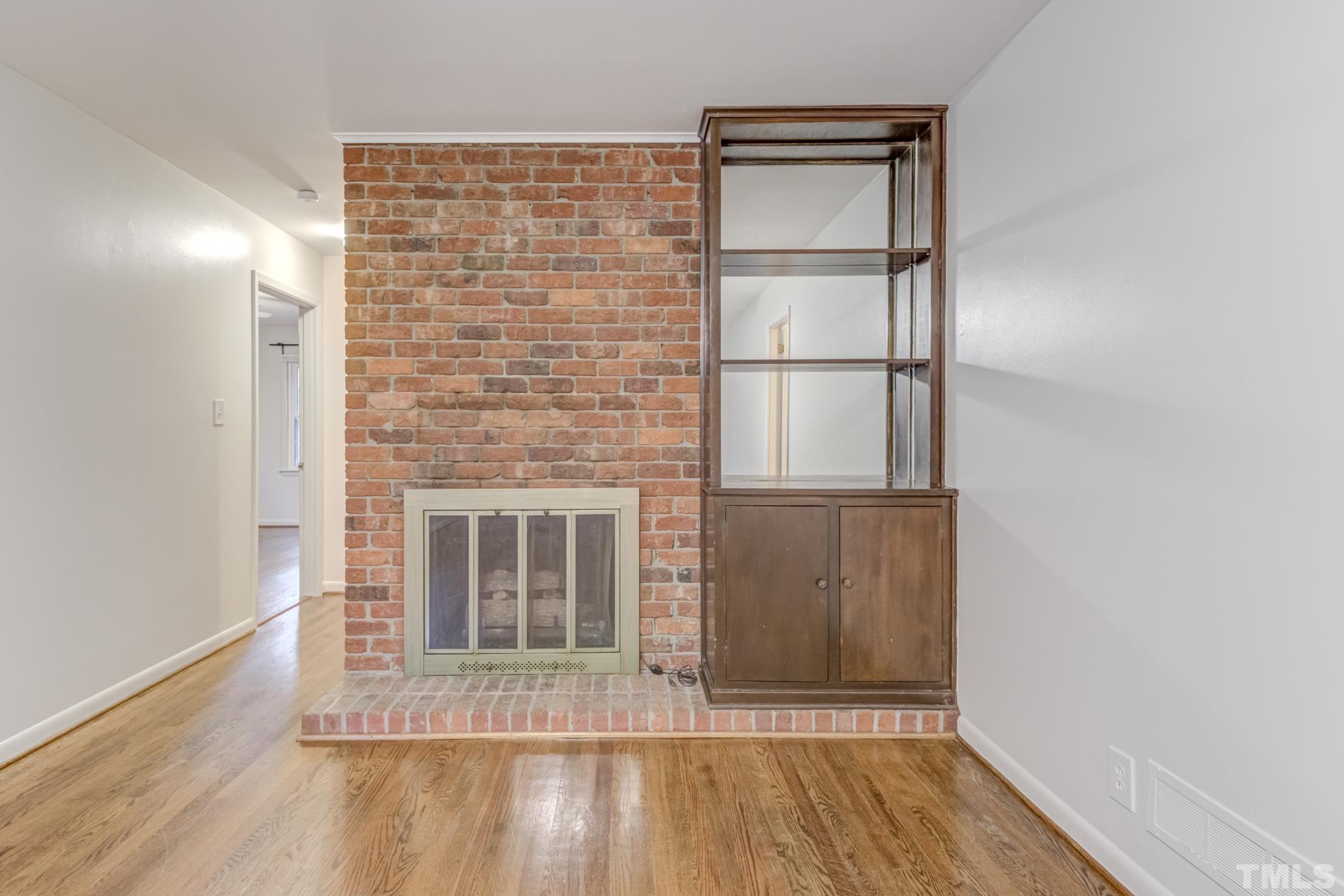 3213 Julian Drive Raleigh, NC 27604 - Photo 14 of 54 a view of an empty room with wooden floor and a window