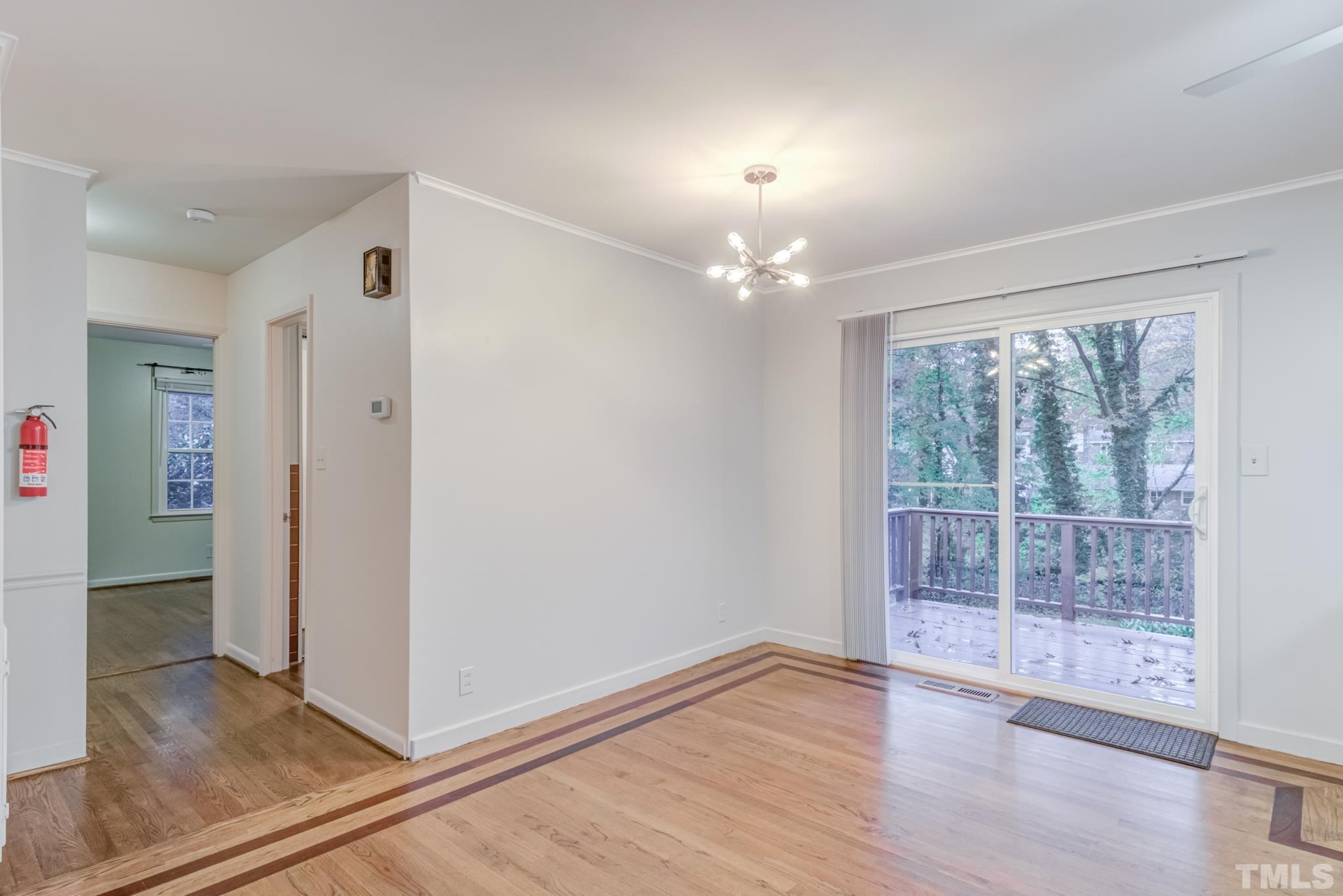 3213 Julian Drive Raleigh, NC 27604 - Photo 15 of 54 wooden floor in an empty room with a window
