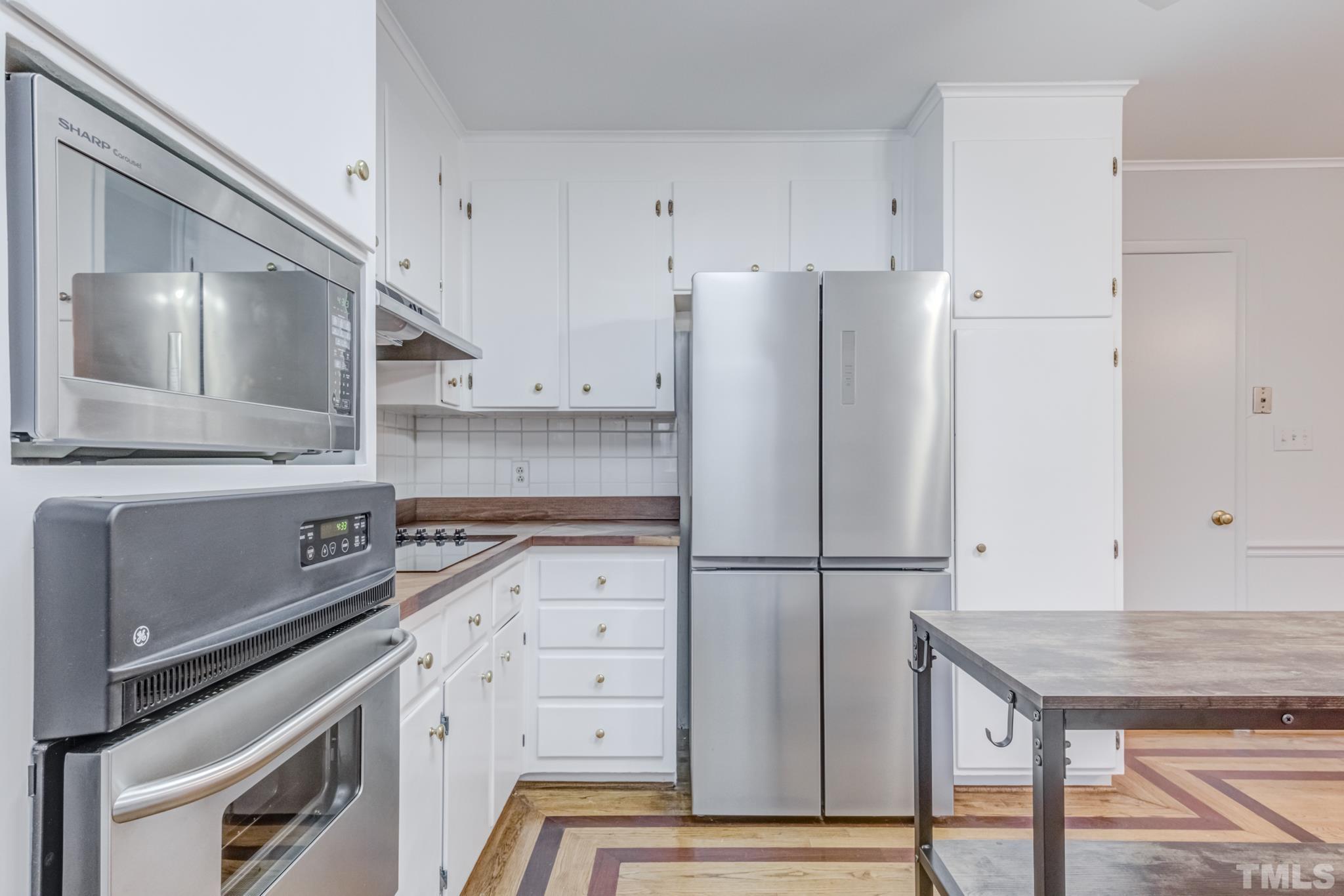 3213 Julian Drive Raleigh, NC 27604 - Photo 22 of 54 a kitchen with appliances and cabinets