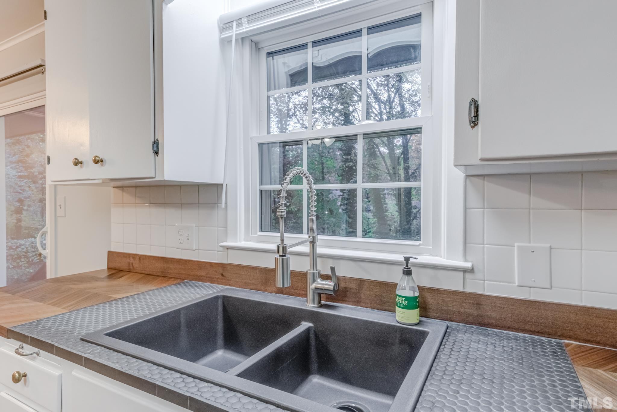 3213 Julian Drive Raleigh, NC 27604 - Photo 25 of 54 a kitchen with a sink and cabinets