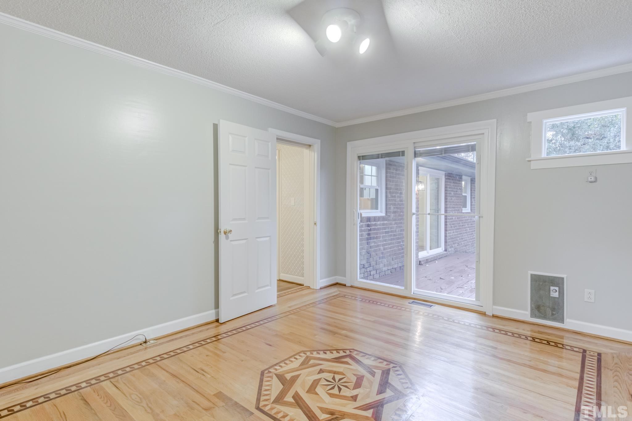 3213 Julian Drive Raleigh, NC 27604 - Photo 30 of 54 wooden floor in an empty room with a window