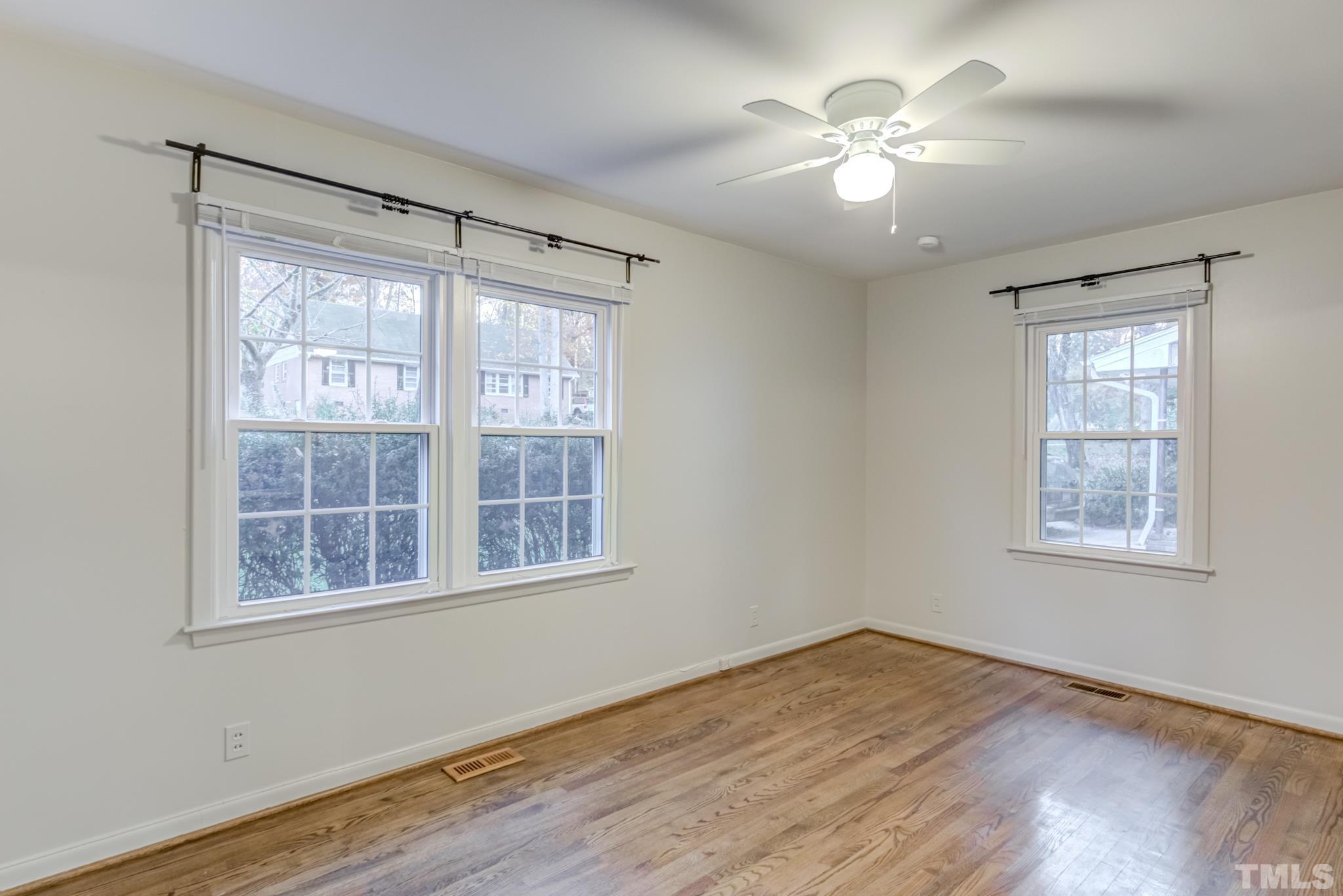 3213 Julian Drive Raleigh, NC 27604 - Photo 38 of 54 a view of an empty room with wooden floor and a window