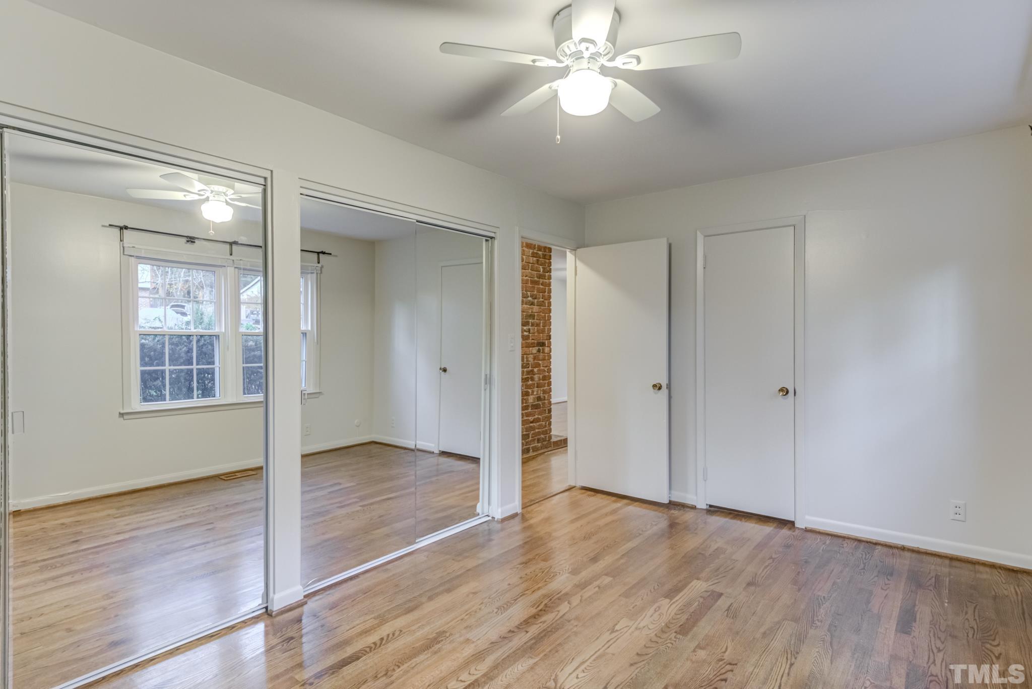 3213 Julian Drive Raleigh, NC 27604 - Photo 40 of 54 a view of an empty room with wooden floor and a window