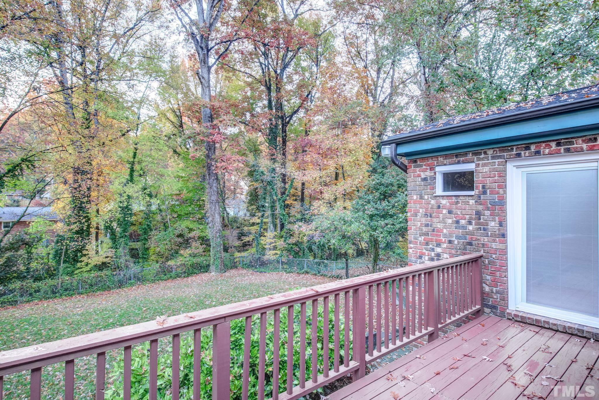 3213 Julian Drive Raleigh, NC 27604 - Photo 42 of 54 a view of a wooden deck and a forest
