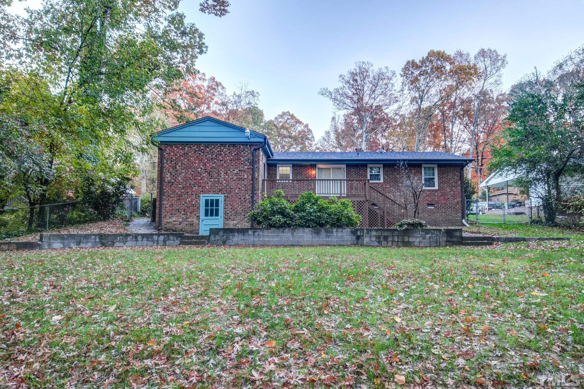 3213 Julian Drive Raleigh, NC 27604 - Photo 46 of 54 a view of a house with a yard and a garden
